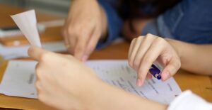 Couple filling out their income taxes at a kitchen table