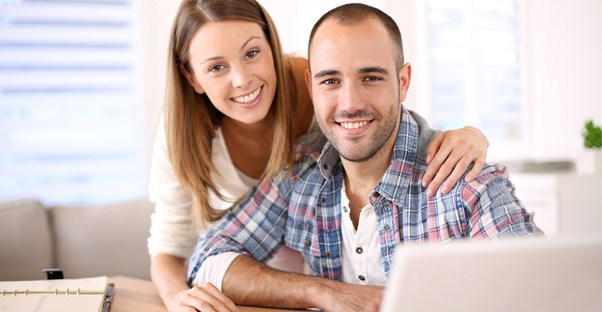 Couple at a table analyzing a 1099 form