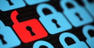 Unlocked red padlock in a sea of locked blue padlocks