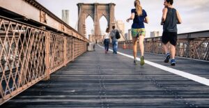 people running on a pier