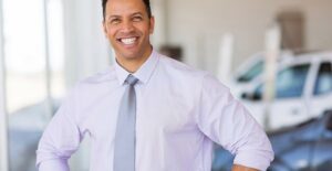 Sales associate smiles after a hard days work