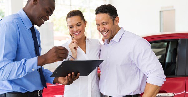 Couple shopping for a car lease