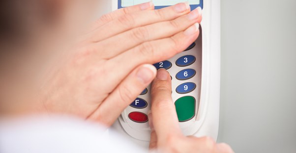 Woman hiding her pin number for security