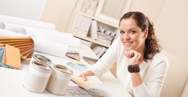An interior decorator goes over paint samples