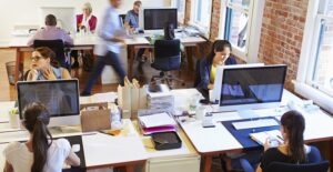 Employees work in an open office
