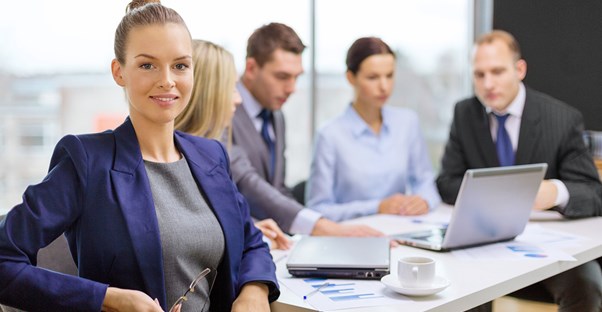 A woman sitting at a table discussing a franchise agreement