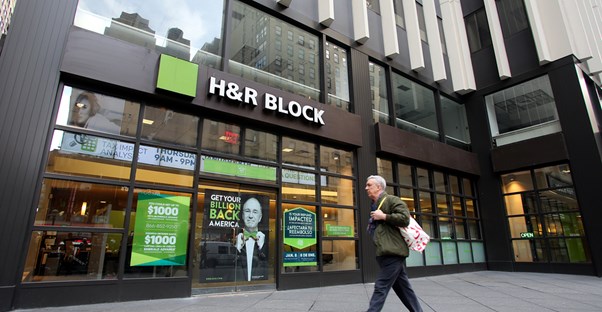 Man walking into a H&R Block