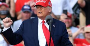 Donald trump standing at a podium