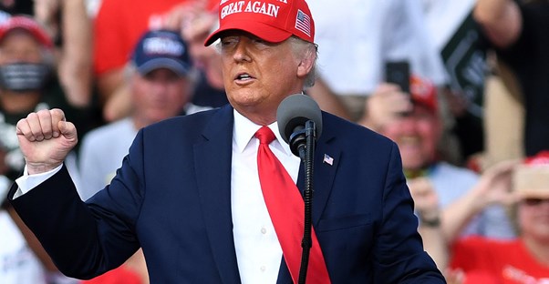 Donald trump standing at a podium