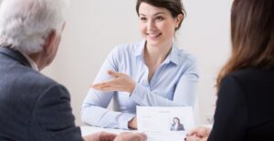 An HR manager discusses job benefits with employees