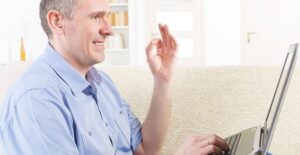 A man practices sign language