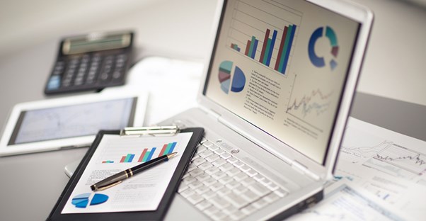 A day trader looks at data on his computer
