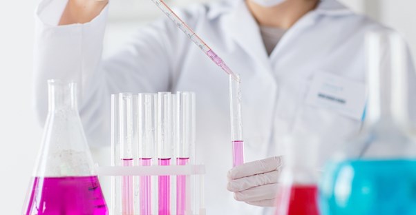 A chemist tests chemicals in a lab
