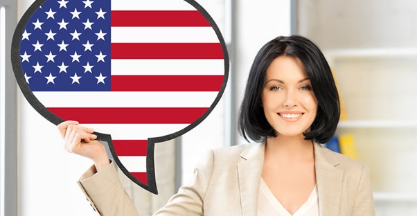 Language translator holds up an American Flag sign