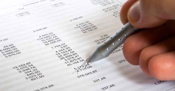 Accountant checking the numbers on a balance sheet