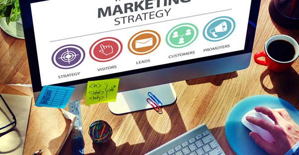A marketing team works on their computer