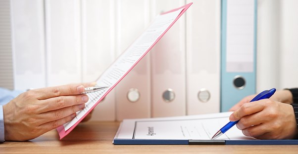 Two employees preparing for an internal audit