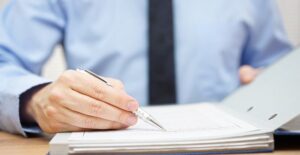 An external auditor is looking over the books