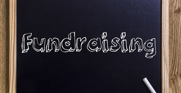 Blackboard with fundraising written on it