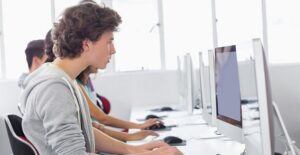 students studying english in a computer lab