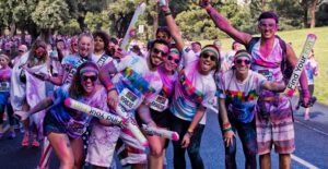 Group of people at a color run, a unique fundraiser.