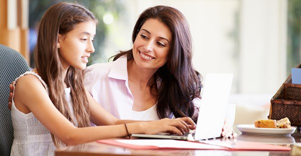 Young woman talks with a young girl