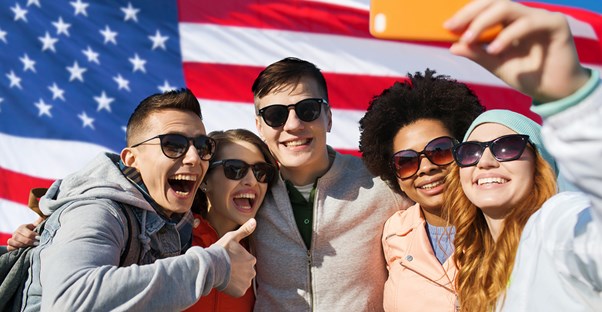 Students take a selfie with a foreign exchange student