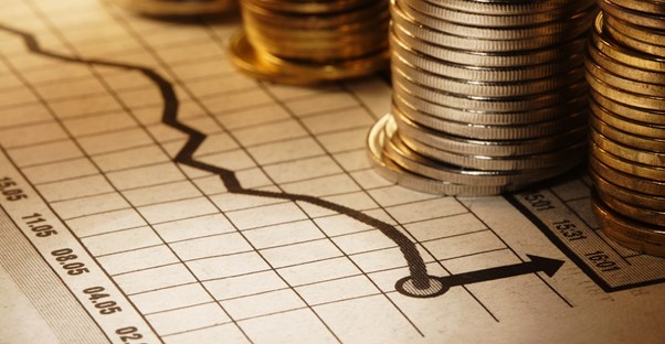 a fundraising chart with stacks of coins on top