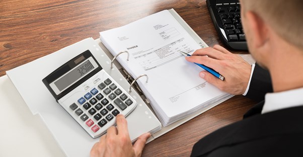 man crunching the numbers to plan the finances for a new nonprofit