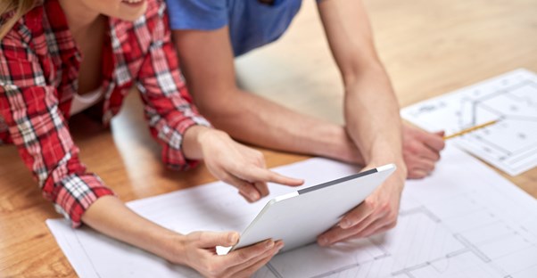 Two architects go over plans together