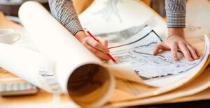 An architect draws out plans