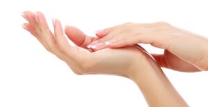 a woman massages away the pain in her hand