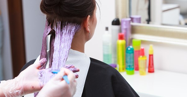 Woman having her hair dyed.