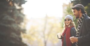 Man and woman walking in sunglasses