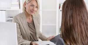 A young college student discusses becoming a public relations major with her academic advisor
