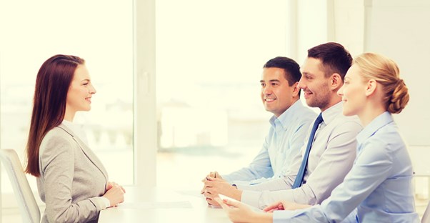 A young woman interviews for an international relations job
