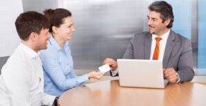Couple meeting with a home appraiser