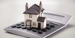 Home sitting on a calculator