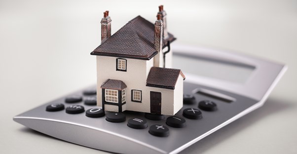 Home sitting on a calculator