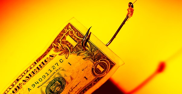 A fish hook pulling in a dollar bill