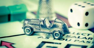 Tiny car on a monopoly board