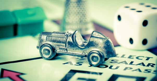 Tiny car on a monopoly board