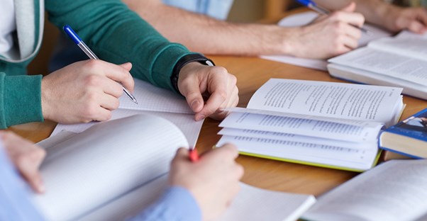 Students using textbooks to study