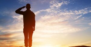 Veteran standing in the sunset