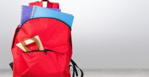 Backpack filled with notebooks and other school supplies