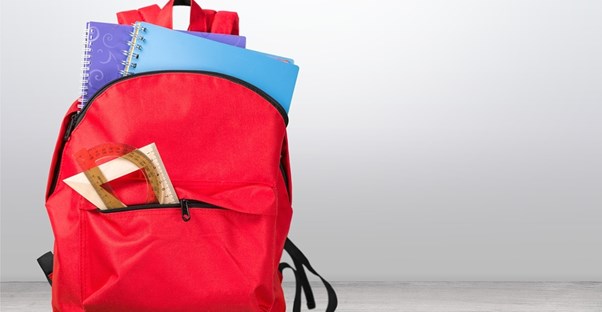 Backpack filled with notebooks and other school supplies