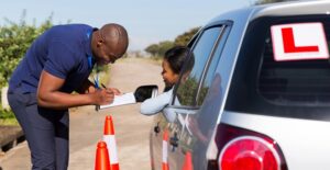 A young woman passes her driving test