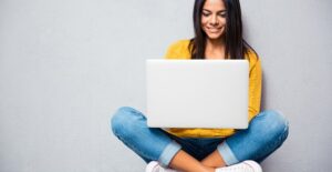 A young student studies for her driving test online