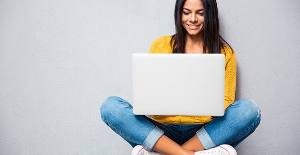 A young student studies for her driving test online