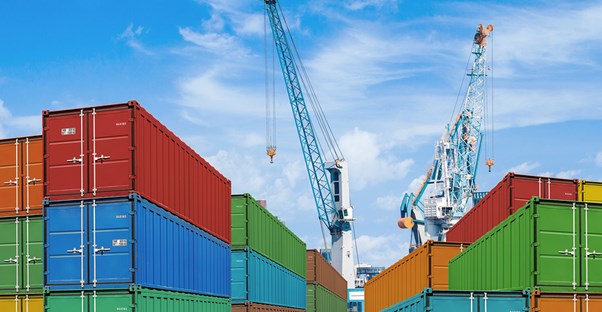 Shipping containers being packed for international shipping